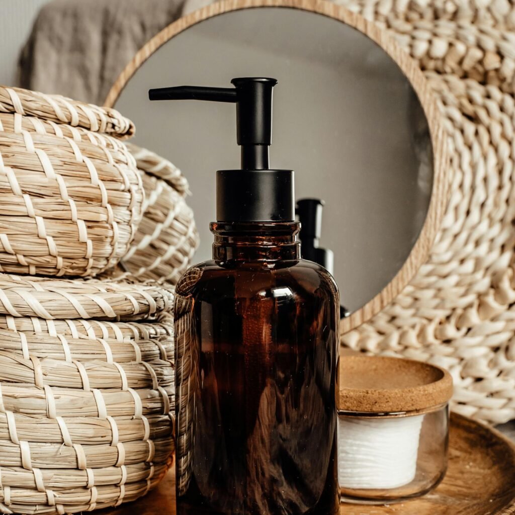 Brown glass dispenser amid natural textures, evoking calm body care.